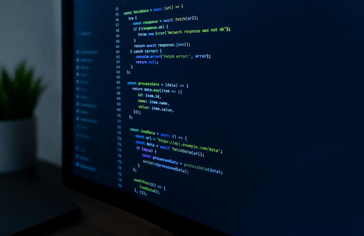 Source code displayed on a dark monitor in a quiet workspace